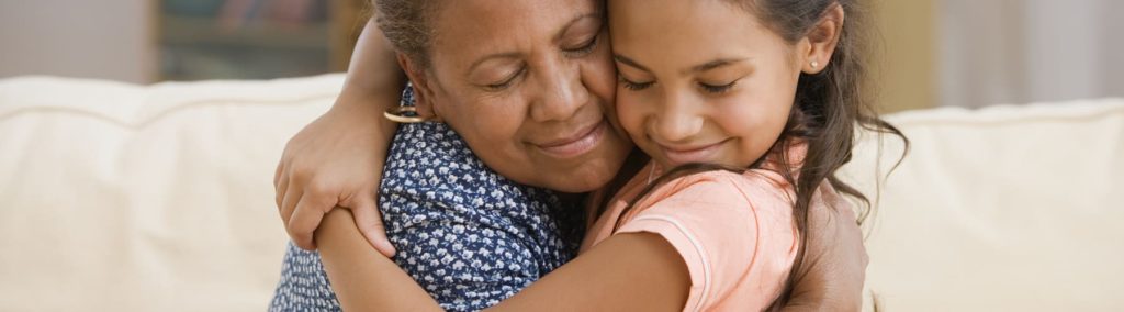 Mother and daughter hugging